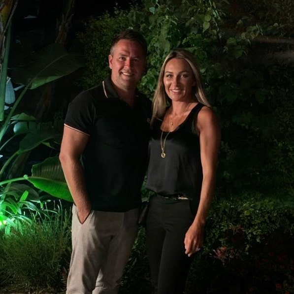 Louise Bonsall on sleeveless black top and jeans with her husband Michael Owen in black t-shirt and white pant.